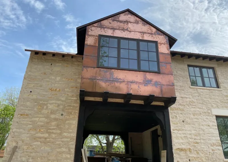 Copper metal panel facade on a stone building for Skylight Installation in Santa Clara